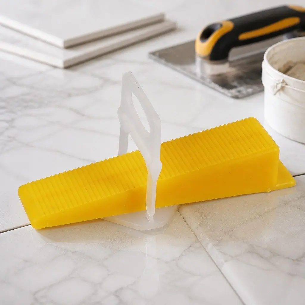 Tile Leveling System Plastic Clips Wedges Pliers Suction Cups 37mm x 37mm White 9cm x 2.3cm Yellow 23cm x 13cm Yellow and Silver 12.5cm x 10.2cm