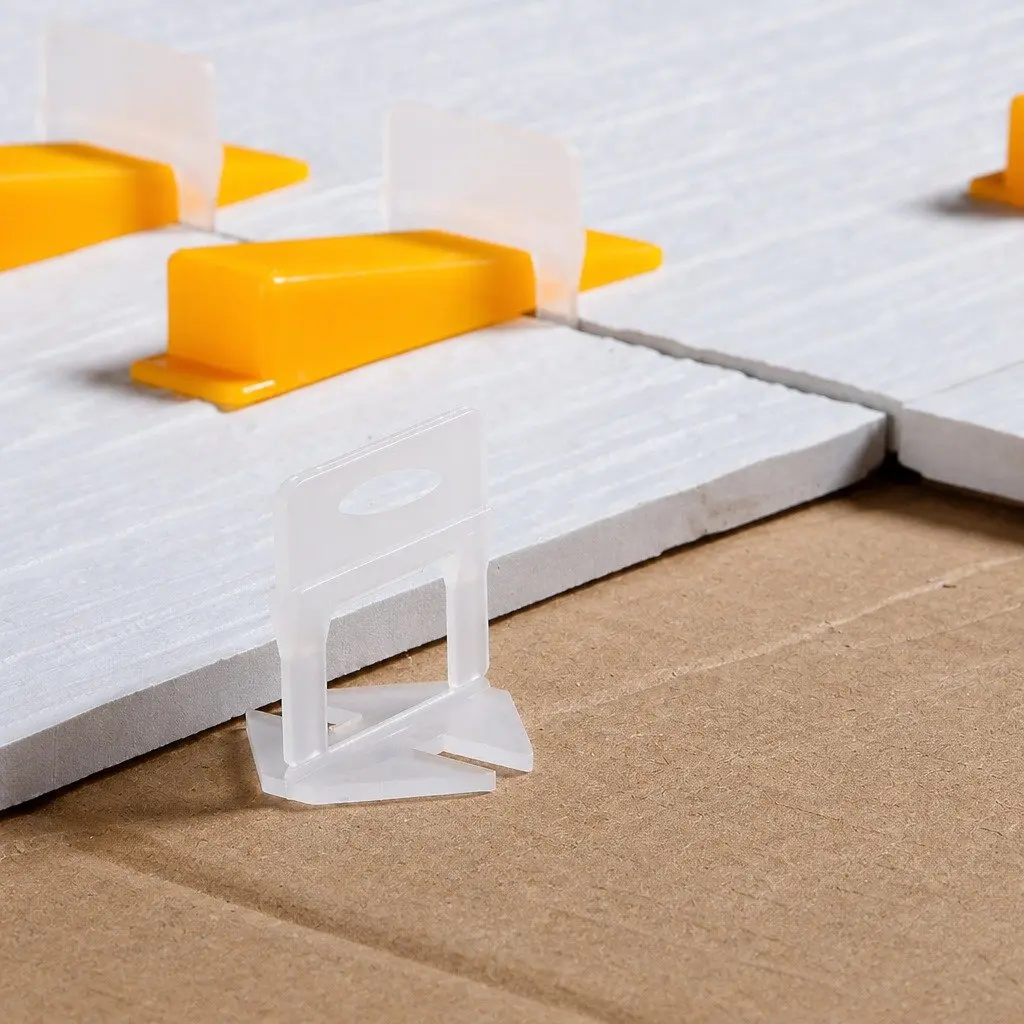 Tile Leveling System Plastic Clips Wedges Pliers Suction Cups 37mm x 37mm White 9cm x 2.3cm Yellow 23cm x 13cm Yellow and Silver 12.5cm x 10.2cm